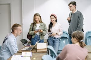 A diverse group of college students engaging in a lively study session indoors.