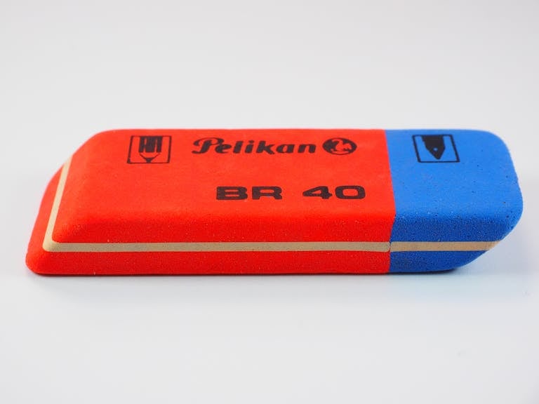 Close-up of a red and blue Pelikan BR 40 eraser, perfect for office supplies.
