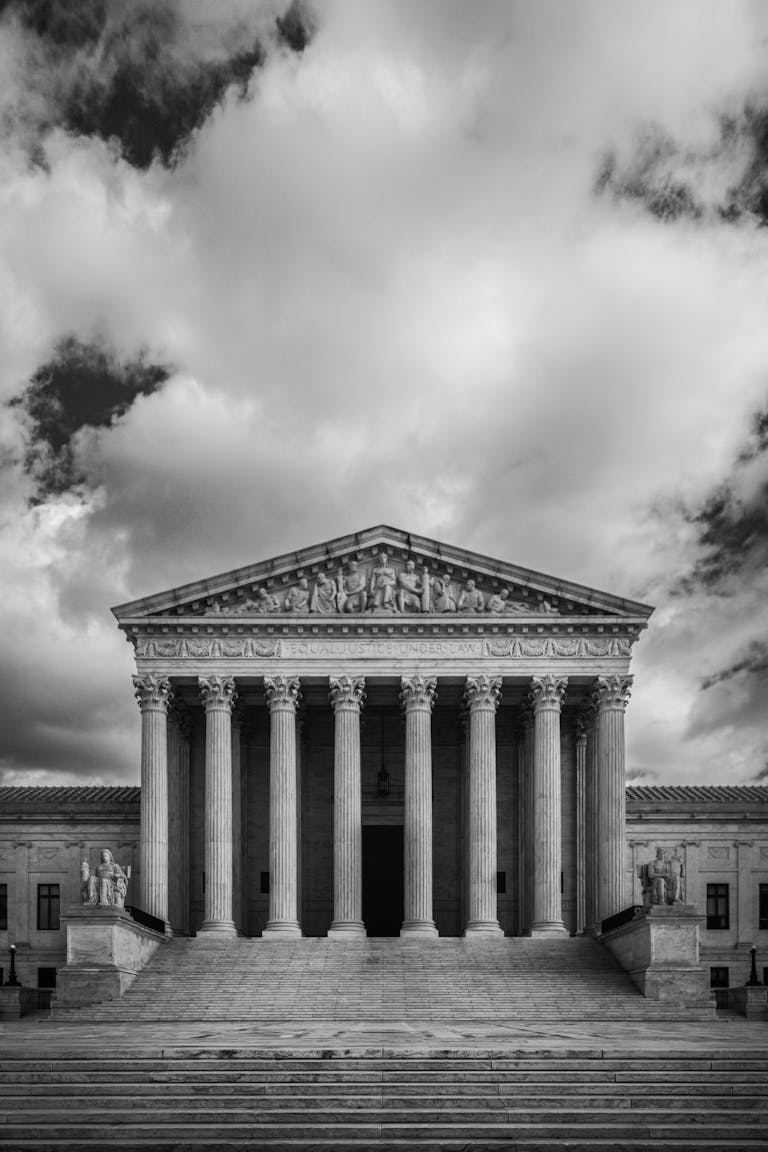Dramatic black and white image of the US Supreme Court in Washington, DC.